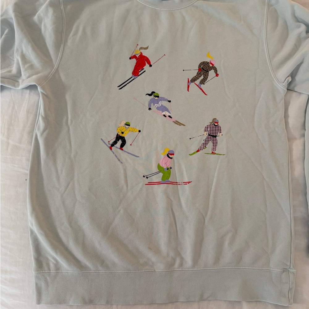 Living Fully - Christmas edition 2025 Light Blue Skiing Graphic Sweater- M